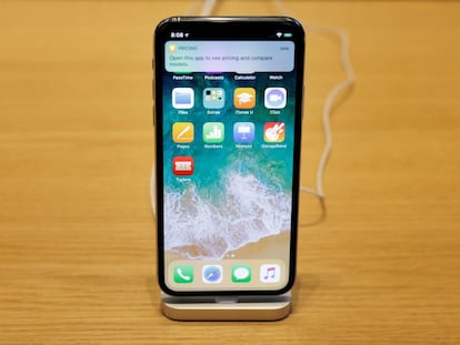 FILE PHOTO: An iPhone X is displayed on a table at an Apple store in New York, U.S., November 3, 2017. REUTERS/Lucas Jackson/File Photo