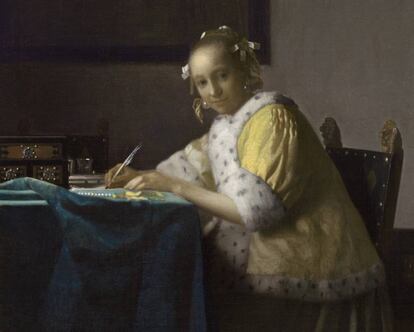 'Dona de groc escrivint una carta', quader de Vermeer del 1665.