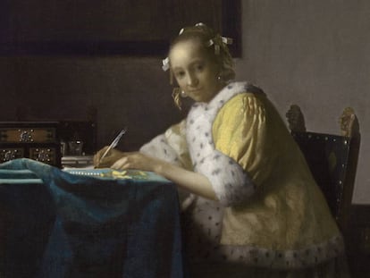 'Dona de groc escrivint una carta', quader de Vermeer del 1665.