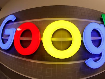 FILE PHOTO: An illuminated Google logo inside an office building in Zurich