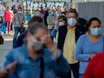 People queue for a rapid antigen test for COVID-19 in the southern neighbourhood of Vallecas in Madrid, Spain, Wednesday, Oct. 7, 2020. About 5.2 million people in Spain, including nearly 4.8 million residents in or around Madrid, are under restrictions on movement due to the second wave of the coronavirus pandemic. (AP Photo/Manu Fernandez)