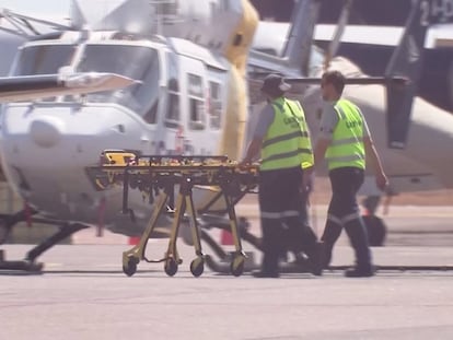 Paramedics push a stretcher following U.S. military aircraft crash in Darwin, Australia, August 27, 2023 in this screen grab obtained from a handout video.