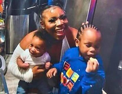 In this photo released by the Young Family via their family attorney,  Ta'Kiya Young is pictured with her sons, Ja'Kobie, right, and Ja'Kenlie, left, in an undated photo