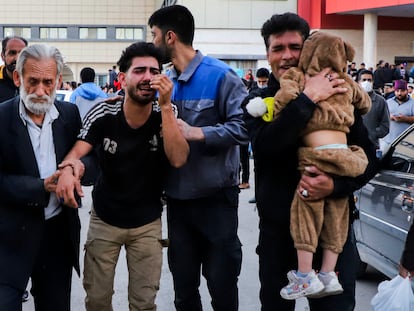 Relatives of victims of the explosions gather outside a hospital in the city of Kerman, Wednesday, January 3, 2024.