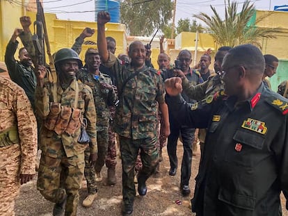 Abdel Fattah al Burhan, leader of the Sudanese army, greets soldiers during a visit to their positions in Khartoum, in an image posted on the armed forces' Facebook page on May 30.