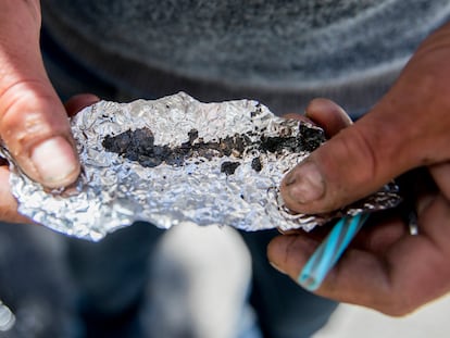 Roger Boyd, 35, holds a piece of foil containing Fentanyl while spending time on McAllister Street in the Tenderloin district of San Francisco, Calif. Friday, June 21, 2019.
