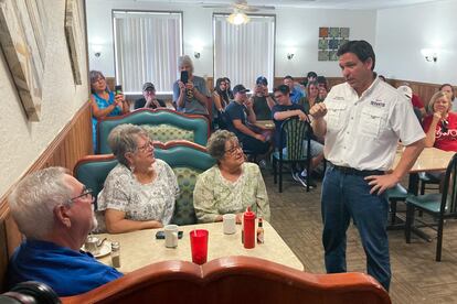 Republican presidential candidate Florida Gov. Ron DeSantis talks with diners at Vinton Family Restaurant in Vinton, Iowa, Saturday, Aug. 5, 2023.