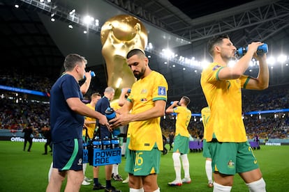 Aziz Behich and Mathew Leckie of Australia drink water during the FIFA World Cup Qatar 2022 Group D match between Australia and Denmark at Al Janoub Stadium on November 30, 2022 in Al Wakrah, Qatar