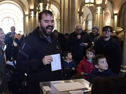 A man casts his ballot for the Catalan regional election at a polling station in Barcelona.