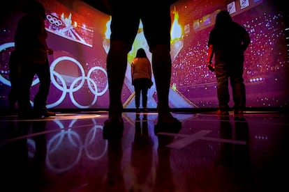 Visitors watch a simulation of the Parade of Nations exhibit during the opening day of the US Olympic and Paralympic Museum in Colorado Springs Colo., on July 30, 2020.