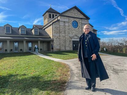 Devout Catholic Ida R. Muorie visits from Orlando, Florida, with the abbey in the background.