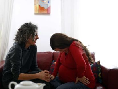 Doula Paca Muñoz with one of the 200 pregnant women she has helped.