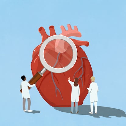Cardiologist doctors holding large magnifying glass over heart