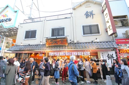 Tourists lining up to witness the mochi-making process at  Nakatanidou, in the Japanese city of Nara.