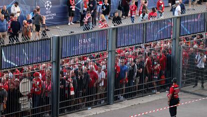 In this file photo taken on May 28, 2022, Liverpool fans stand outside unable to get in time leading to the match being delayed prior to the UEFA Champions League final football match between Liverpool and Real Madrid at the Stade de France in Saint-Denis, north of Paris.