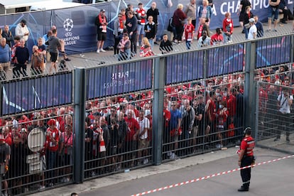 In this file photo taken on May 28, 2022, Liverpool fans stand outside unable to get in time leading to the match being delayed prior to the UEFA Champions League final football match between Liverpool and Real Madrid at the Stade de France in Saint-Denis, north of Paris.