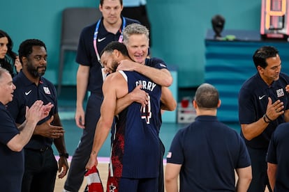 Steve Kerr hugs Stephen Curry after winning Olympic gold in Paris.