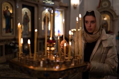 A parishioner inside the Church in honor of the Mother of God in Dnipro.