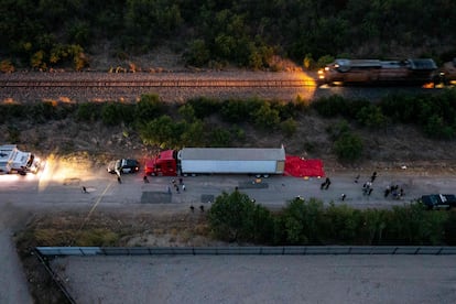Authorities work around the tractor-trailer, on June 27, 2022 in San Antonio, Texas.