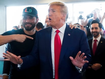Former UFC fighter Jorge Masvidal poses with former President Donald Trump as he visits Versailles restaurant on June 13, 2023, in Miami.