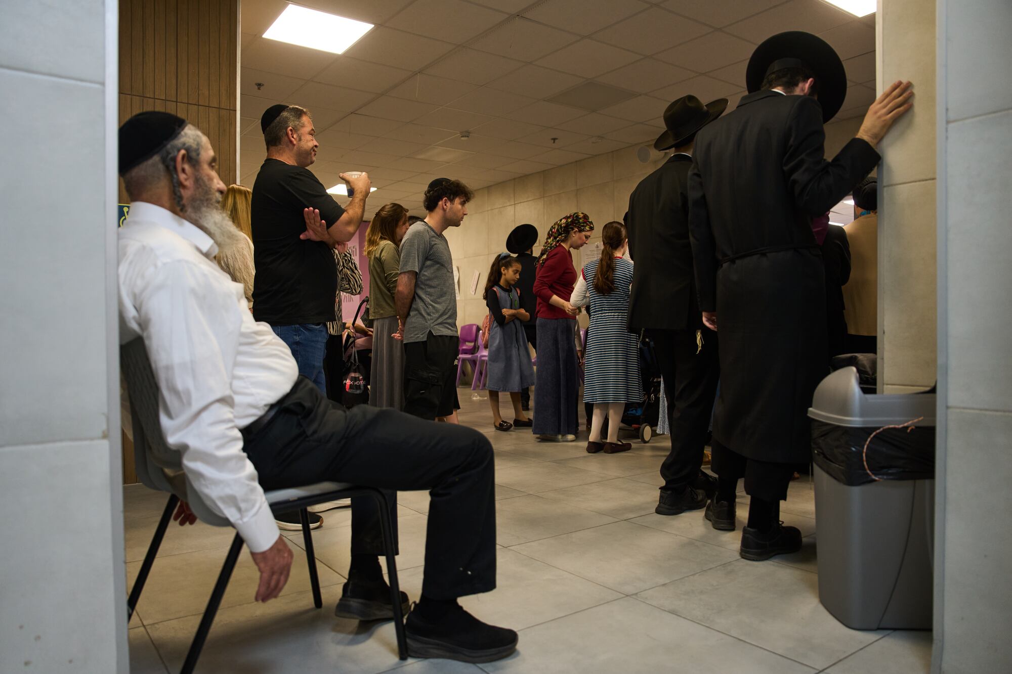 Voters line up to cast their ballots at a school serving as a polling station during Israel's general election in Bnei Brak, Tuesday, Oct. 27, 2026. (AP Photo/Oded Balilty)