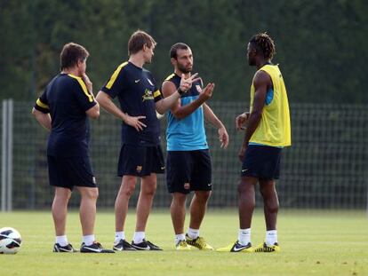 Mascherano con Tito Vilanova durante un entrenamiento del Barça.