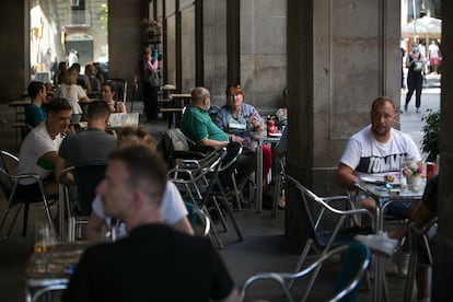 A street packed with café tables in Barcelona on June 13.