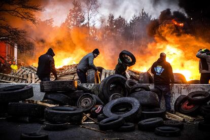 Dutch and Belgian farmers burn tires and wood as they block the border crossing between The Netherlands and Belgium, in Arendonk, Netherlands, 02 February 2024