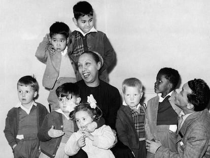 Joséphine Baker and her husband, Joe Bouillon, pose with seven of their 12 adopted children. Jean-Claude is the first from the left.