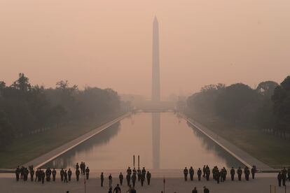 Washington Monument in the background and a thick layer of smoke