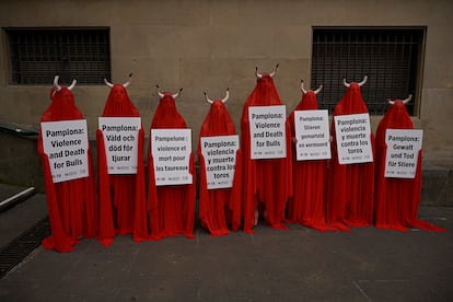 People covered with San Fermin's red color protested on Wednesday against animal cruelty before the start of the San Fermin festival in Pamplona.
