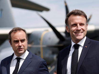 FILE - French Defense Minister Sebastien Lecornu, left, receives President Emmanuel Macron at the 55th International Paris Airshow at Le Bourget Airport near Paris, June 20, 2025. (Benoit Tessier/AP File)