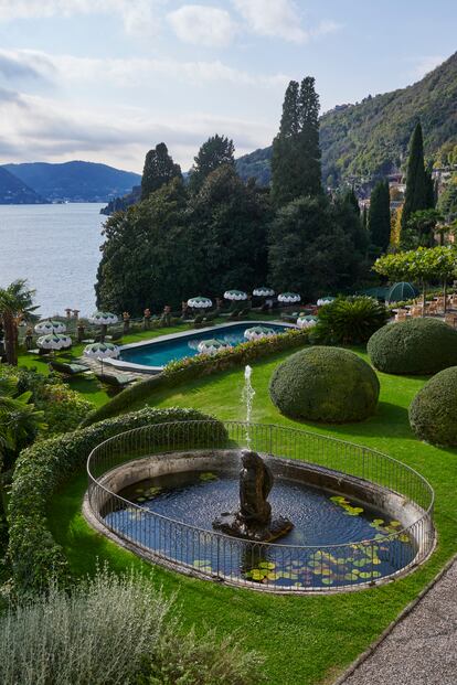 A view of the garden and pool, with its characteristic lily-petal parasols.