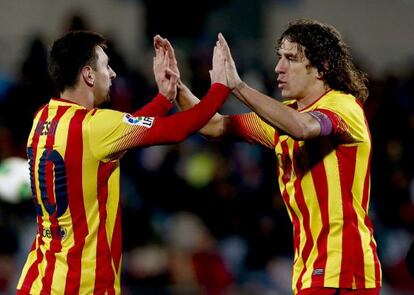 Messi y Puyol celebran el segundo gol ante el Getafe