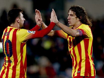 Messi y Puyol celebran el segundo gol ante el Getafe