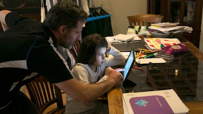 Spanish children taking online classes at home on March 11.