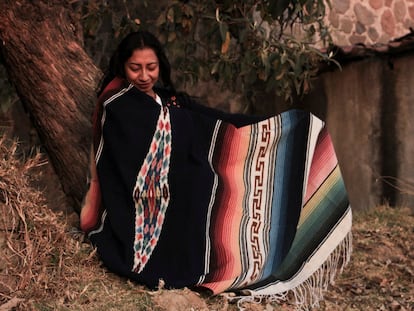 A woman wearing a traditional indigenous Mexican serape.