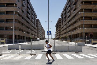 A man jogs through the deserted streets of the uninhabited Seseña housing development some 30 kilometers south of  Madrid.