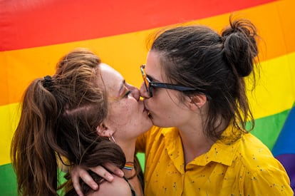 Two girls kiss during a LGBT demonstration for the approval