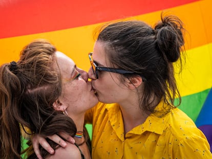 Two girls kiss during a LGBT demonstration for the approval