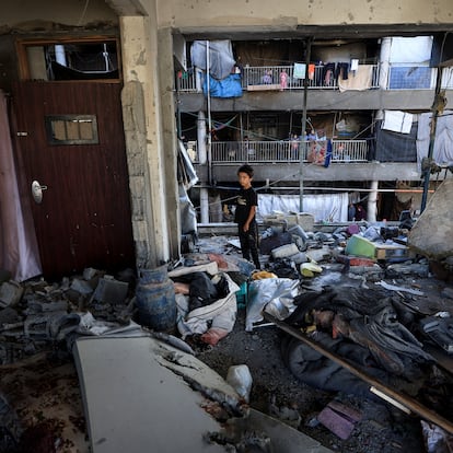 A Palestinian boy inspects the damage at an UNRWA school sheltering displaced people that was hit in an an overnight Israeli strike, in Gaza City, July 5, 2025. REUTERS/Dawoud Abu Alkas TPX IMAGES OF THE DAY     