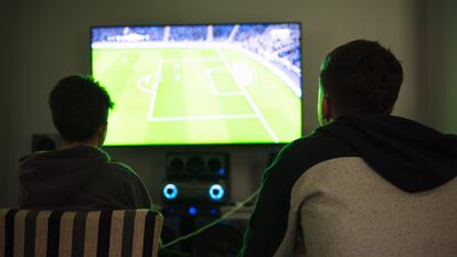 Two children playing a video game.