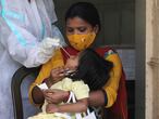 New Delhi (India), 15/04/2021.- A child has her swab sample collected to be tested for COVID-19 in New Delhi, India, 15 April 2021. A weekend curfew was announced on 15 April in Delhi as India recorded its highest daily spike of COVID-19 cases on 14 April with around 200,000 new infections in 24 hours. (Nueva Delhi) EFE/EPA/RAJAT GUPTA