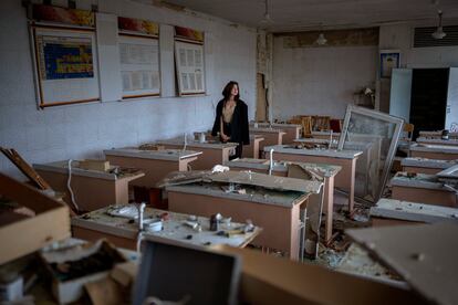 Surrounded by shards of broken glass and rubble 16-year-old Khrystyna Ignatova, sits at her desk in the remains of her classroom in the Chernihiv School #21, which was bombed by Russian forces on March 3, in Chernihiv, Ukraine, Tuesday, Aug. 30 , 2022. "What happened is a tragedy. I already cried out about everything I lost. I miss my school, friends, and teachers. But there will be a new school, new teachers and friends. The most important is that life goes on" Khrystyna said. (AP Photo/Emilio Morenatti)