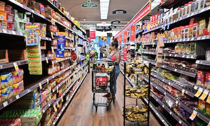 A woman shops for groceries at a supermarket in Monterey Park, California, on October 19, 2022.