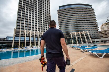 Benidorm's tourism sector is getting ready to reopen. Above, a maintenance worker at the Hotel Bali.