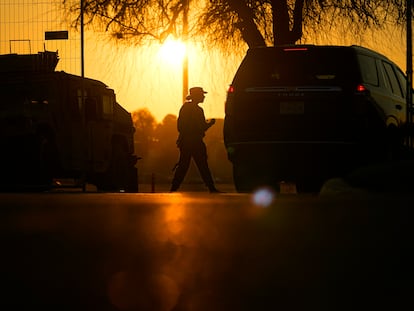 A guardsman checks a vehicle at the gate for Shelby Park, which troops from the Texas National Guard seized and began turning away federal immigration authorities, Thursday, Feb. 1, 2024, in Eagle Pass, Texas.