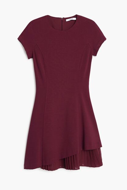 Al más puro estilo Victoria Beckham. Vestido de Mango con doble falda (45,99 euros).