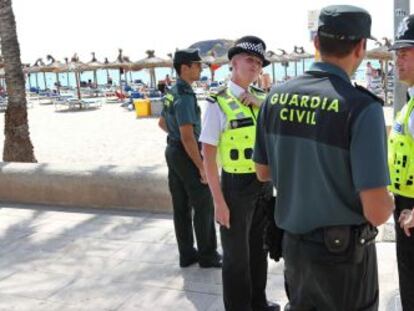 Spanish Civil Guard officers and British policeman on patrol in Magaluf.