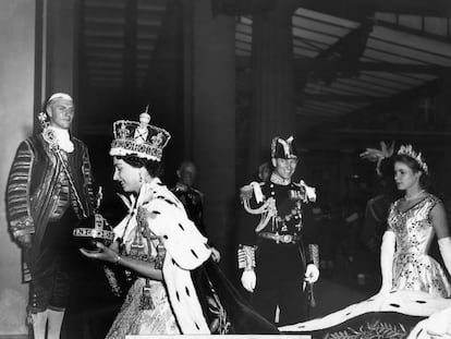 FILE  - Britain's Queen Elizabeth II, carrying the orb and the scepter, enters Buckingham Palace after her Coronation ceremony in London's Westminster Abbey, June 2, 1953.Queen Elizabeth II, Britain’s longest-reigning monarch and a rock of stability across much of a turbulent century, has died. She was 96. Buckingham Palace made the announcement in a statement on Thursday Sept. 8, 2022. (AP Photo/Pool via AP, File)